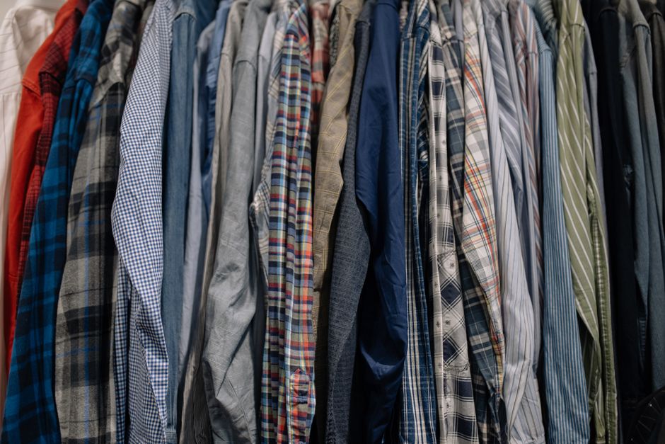Shirts hanging neatly in a well-designed wardrobe space