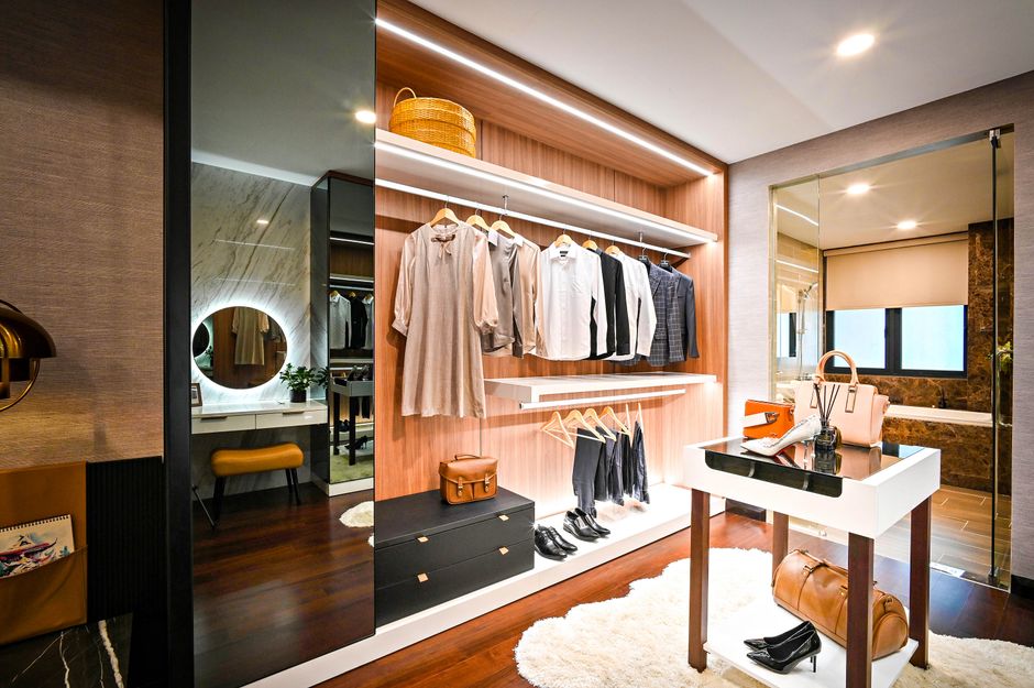 Luxury walk-in custom closet with elegant shelving and lighting